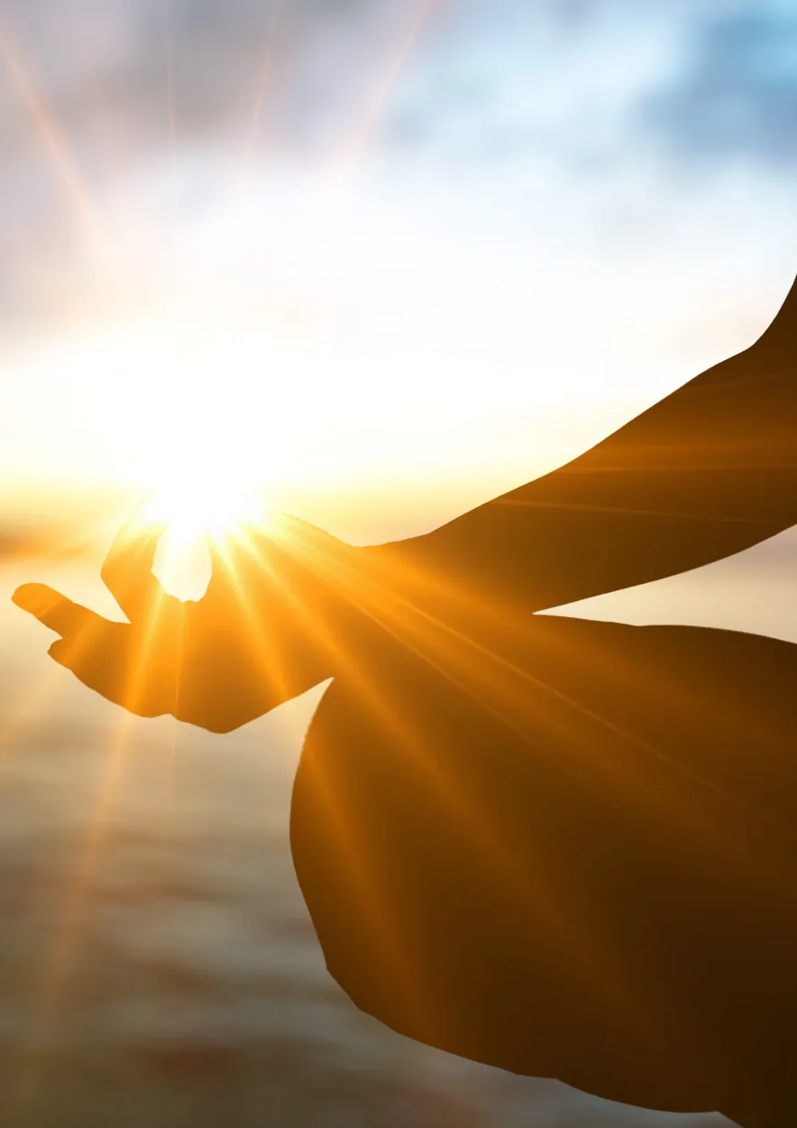Open hand cupping sunlight in a quiet moment of reflection