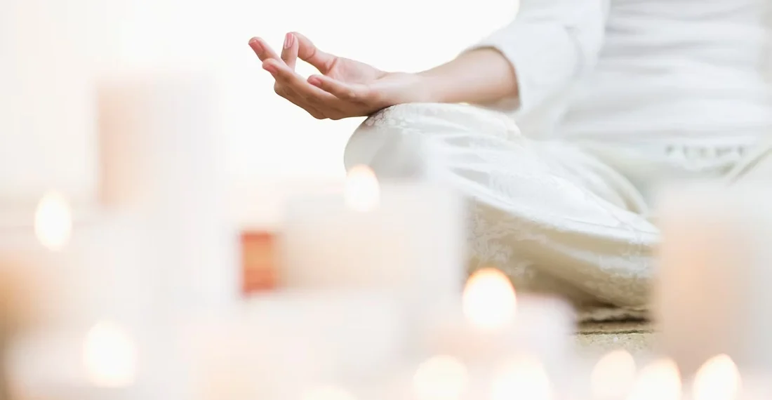 Meditation in soft warm candlelight